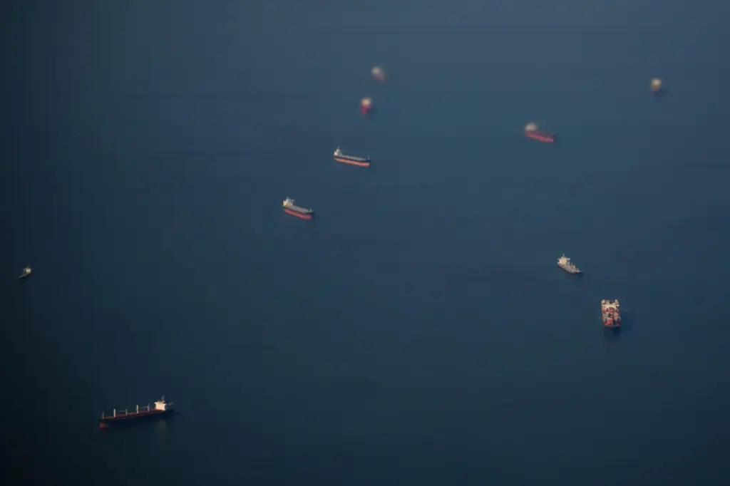 FILE – Ships are anchored near the Chesapeake Bay Bridge,...