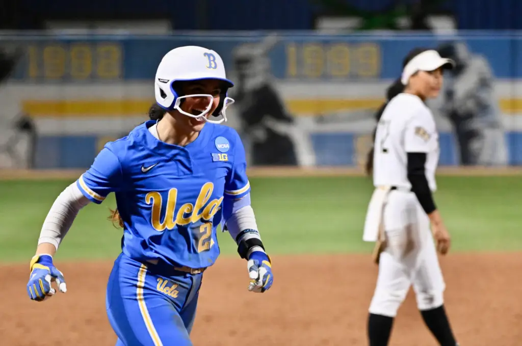 Aleena Garcia #21 of the UCLA Bruins reacts after hitting...