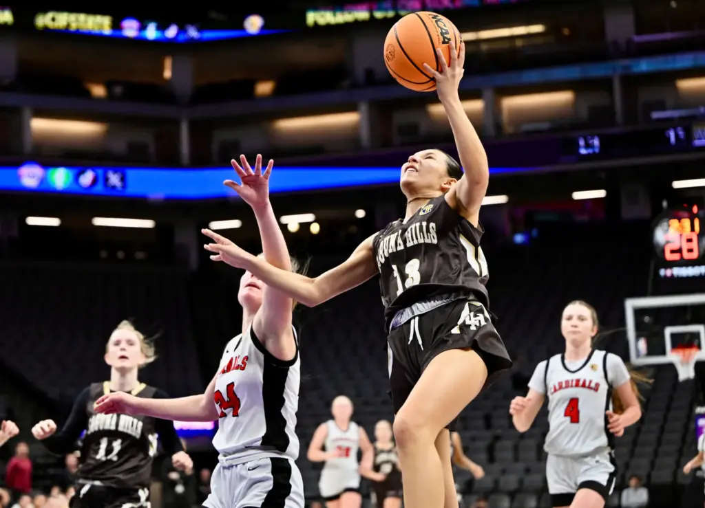 Lena Goodman #13 of Laguna Hills drives to the basket...