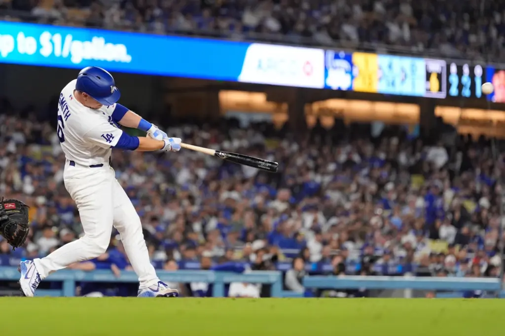 The Dodgers’ Will Smith hits a solo home run during...