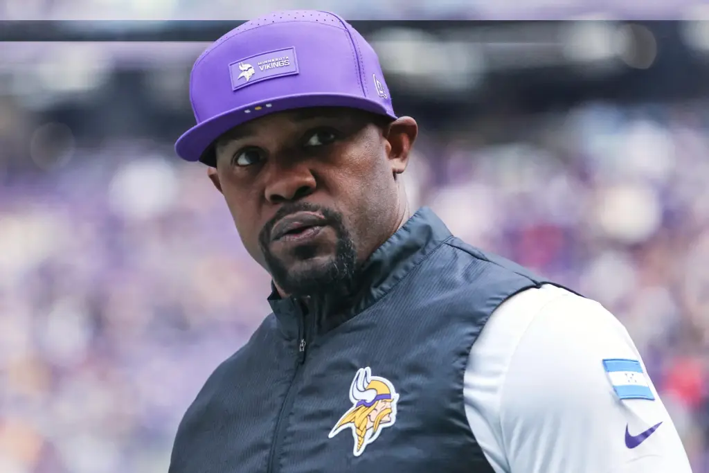 Brian Flores stands on the sideline
