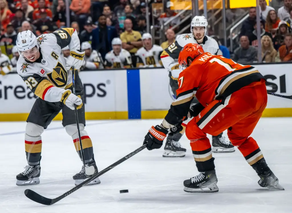 The Vegas Golden Knightsâ Mitch Marner, left, takes a shot...