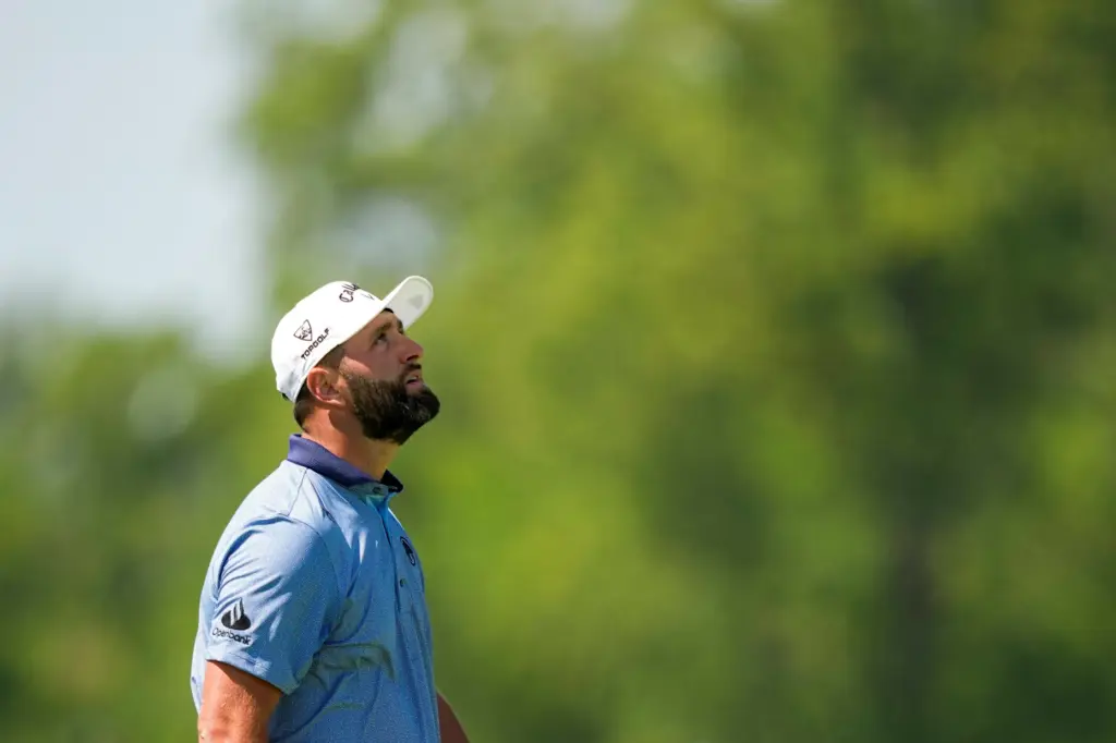 Jon Rahm, of Spain, looks upwards after a missed shot...
