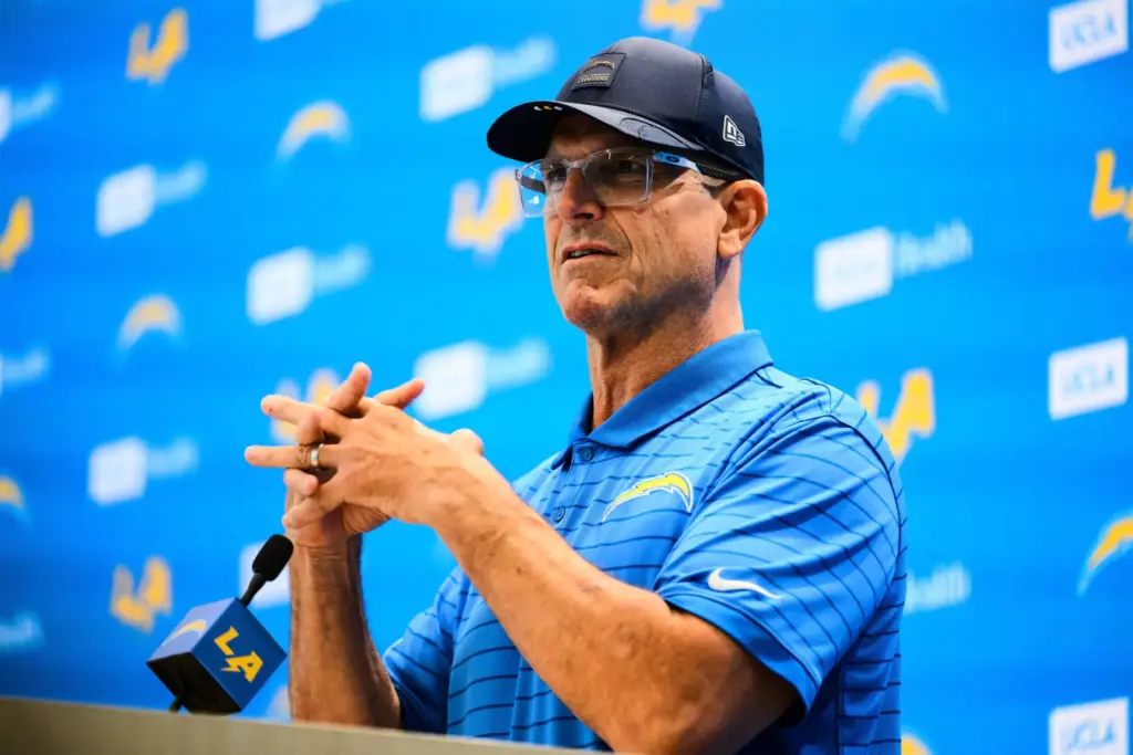 Chargers head coach Jim Harbaugh speaks to reporters before the...