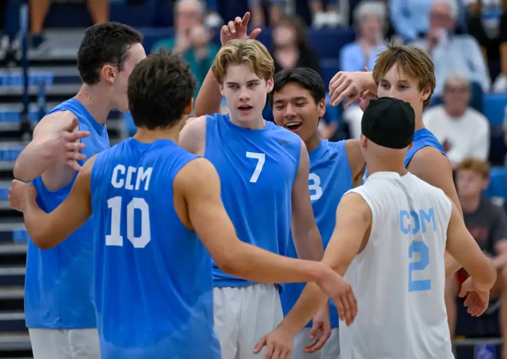 Corona del Mar players celebrate after defeating Mater Dei in...