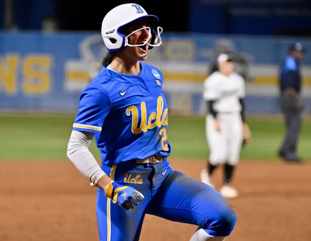 Aleena Garcia #21 of the UCLA Bruins reacts after hitting...