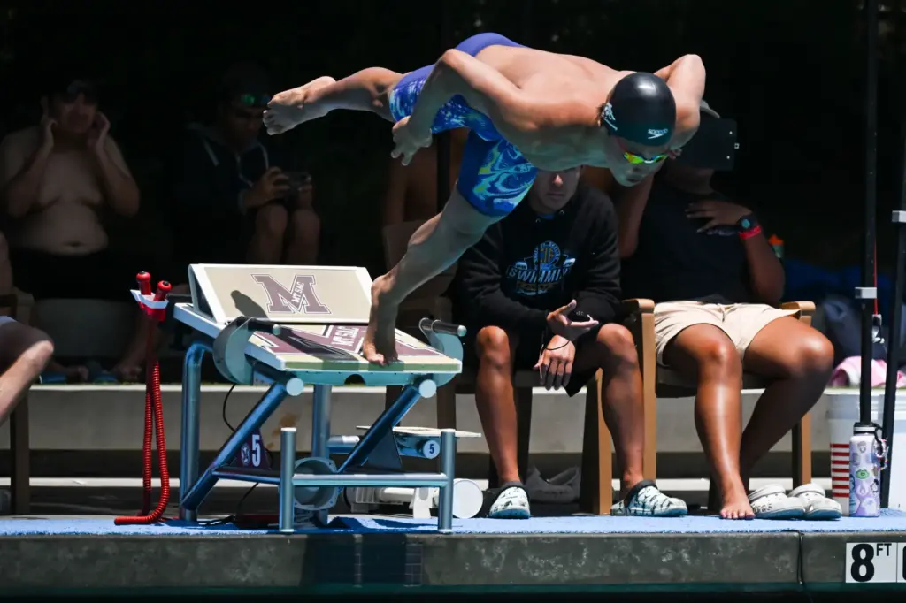 Andrew Maksymowski of Northwood High School dives in for the...