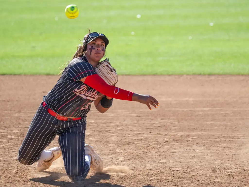 Mission Viejo shortstop Mars Ruvalcaba throws to first base from...