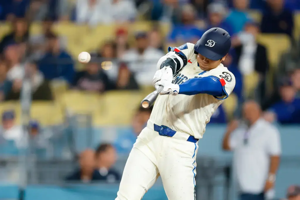 Dodgers designated hitter Shohei Ohtani (17) hits a single during...