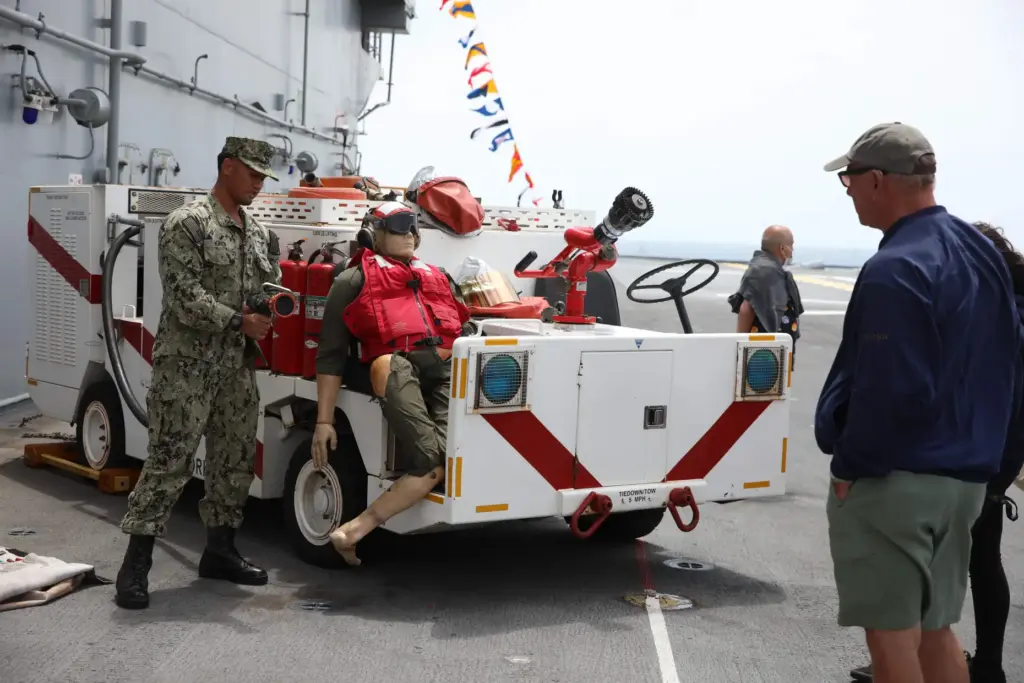 ABH3 Chad Kihoi goes over some of the firefighting equipment...
