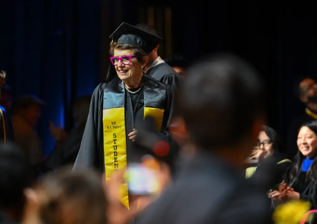 Billie Jean King walks the stage as she receives her...