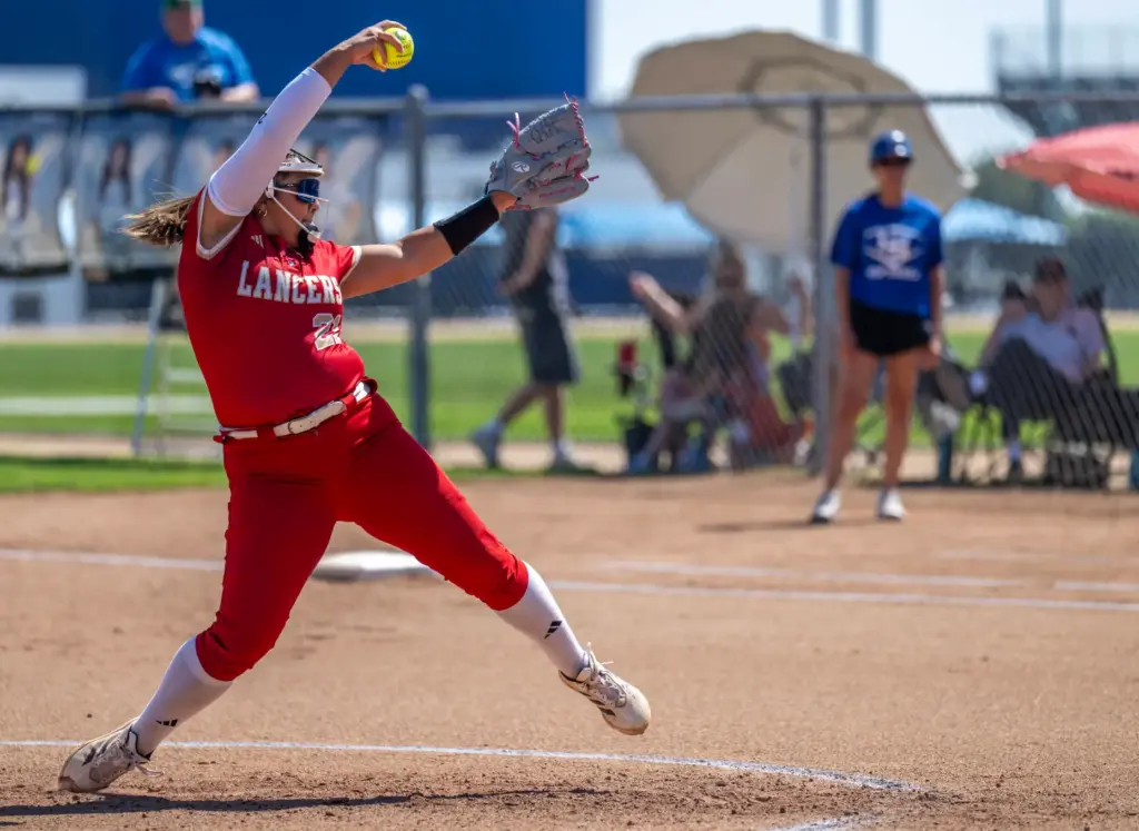 Orange Lutheran starting pitcher Rylee Silva throws to home plate...