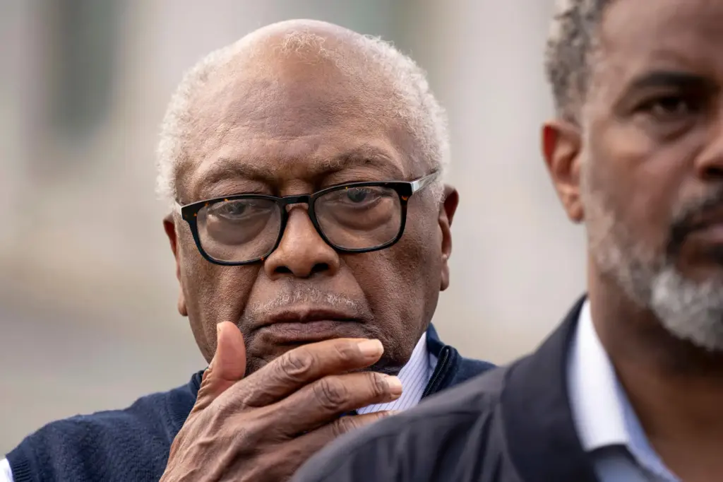 Rep. Jim Clyburn, D-S.C., center, stands with members of the Congressional Black Caucus