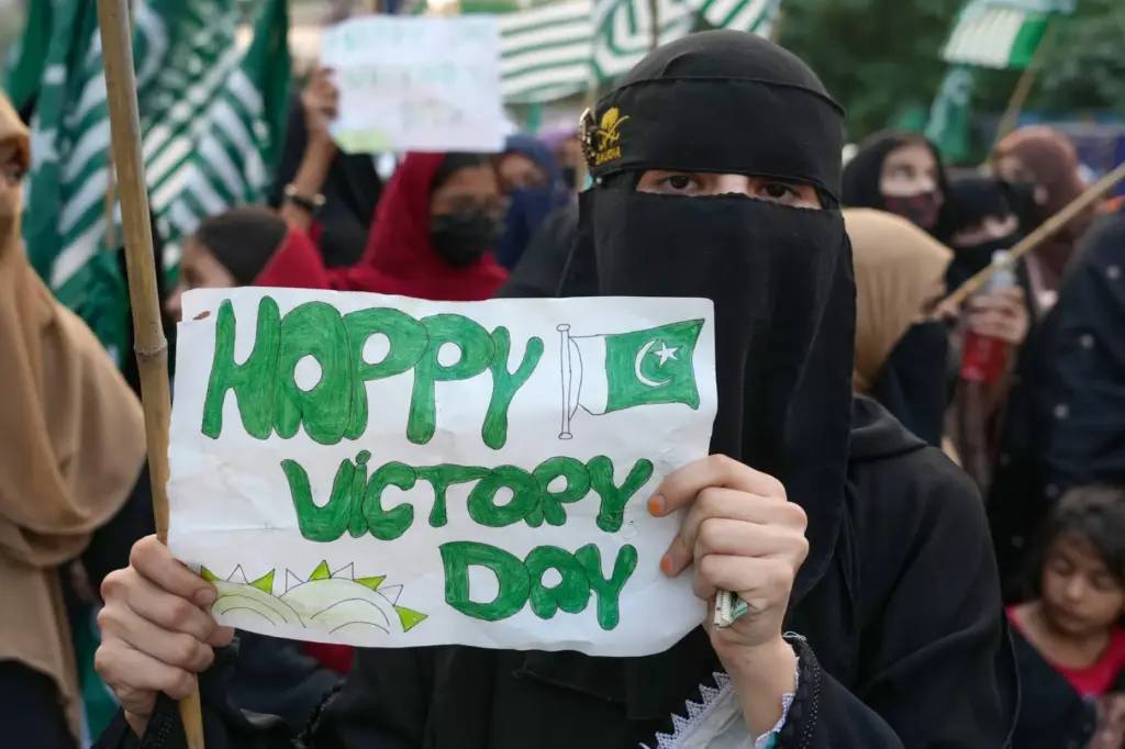 Supporters of Muslim women league Pakistan, hold a placard