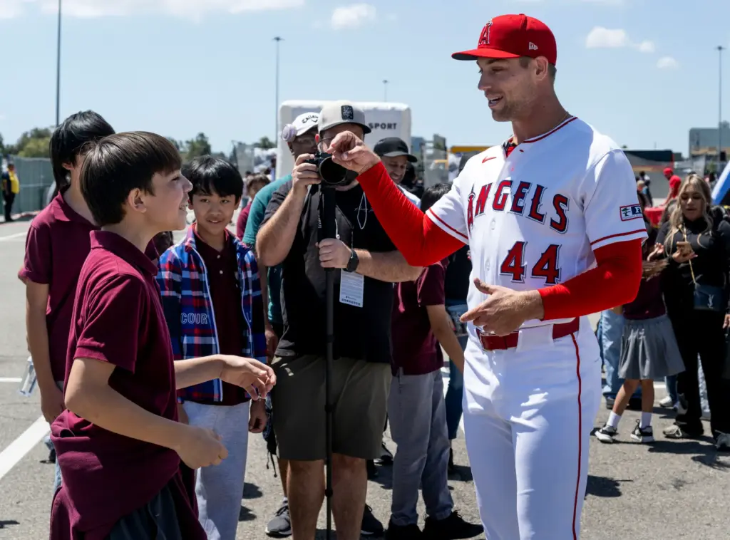 Angels pitcher Ben Joyce talks to a student during STEAM...