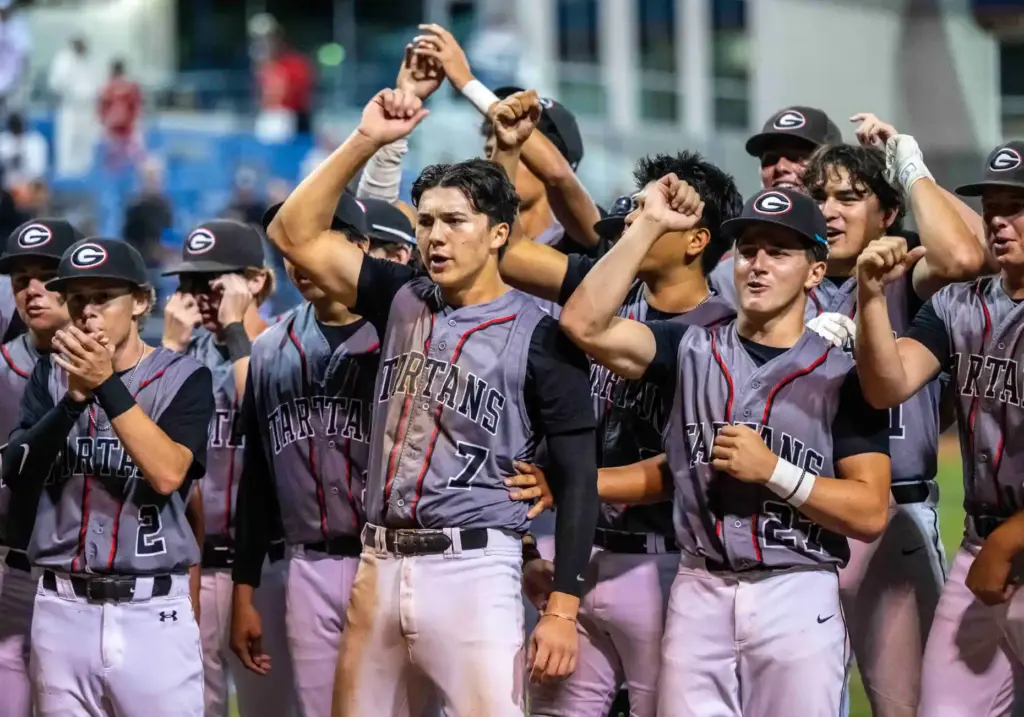 Glendora players celebrate as they beat Laguna Beach 3-2 in...