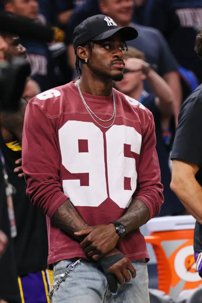 Los Angeles Lakers’ Jarred Vanderbilt holds his right hand that...