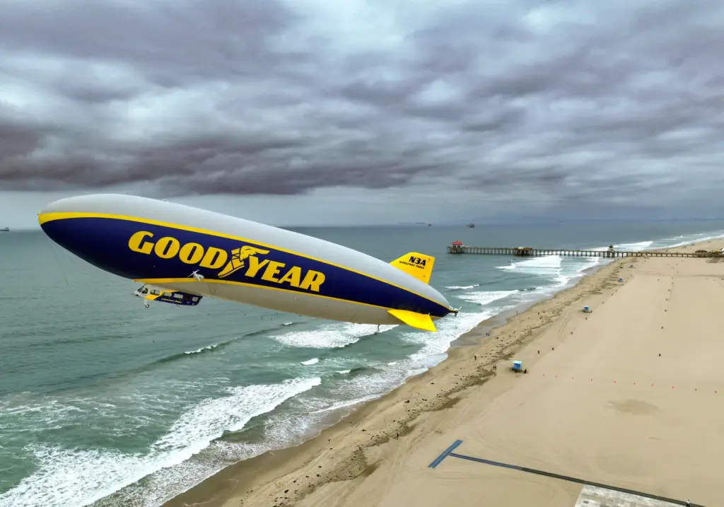 The Goodyear Blimp Wingfoot Three takes off from the beach...