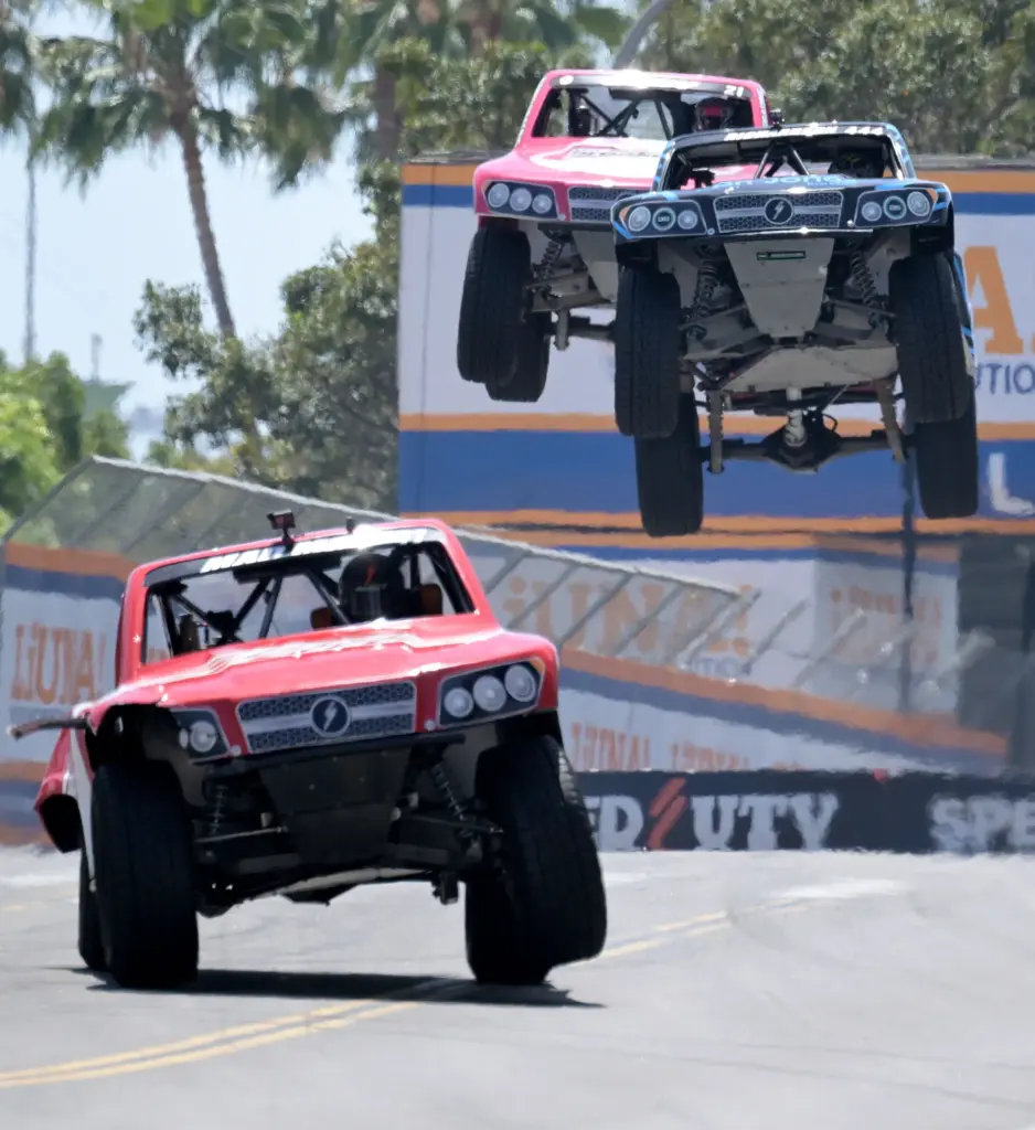 Stadium Super Truck drivers Max Gordon, front left, leads Shaun...