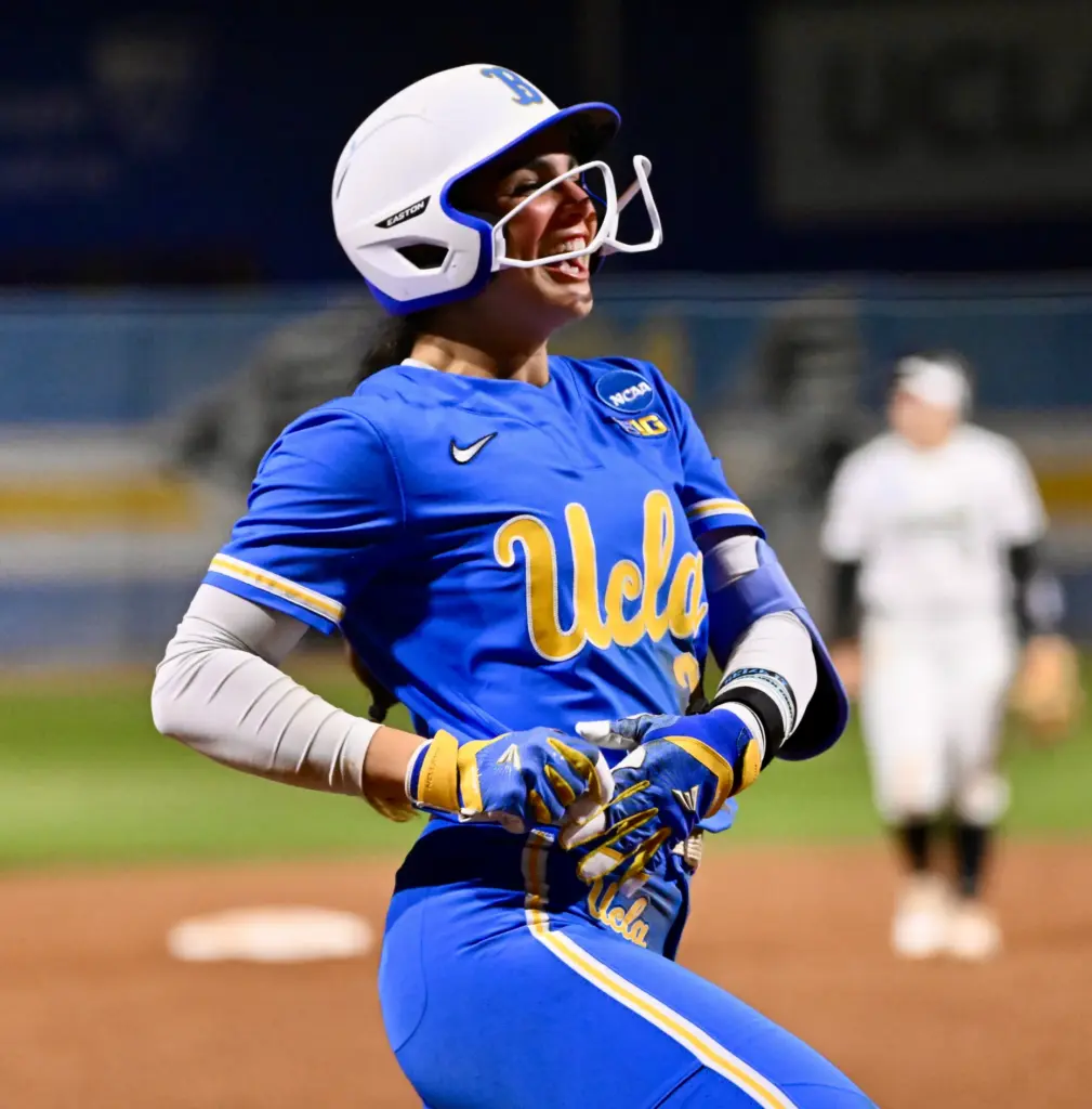 Aleena Garcia #21 of the UCLA Bruins reacts after hitting...