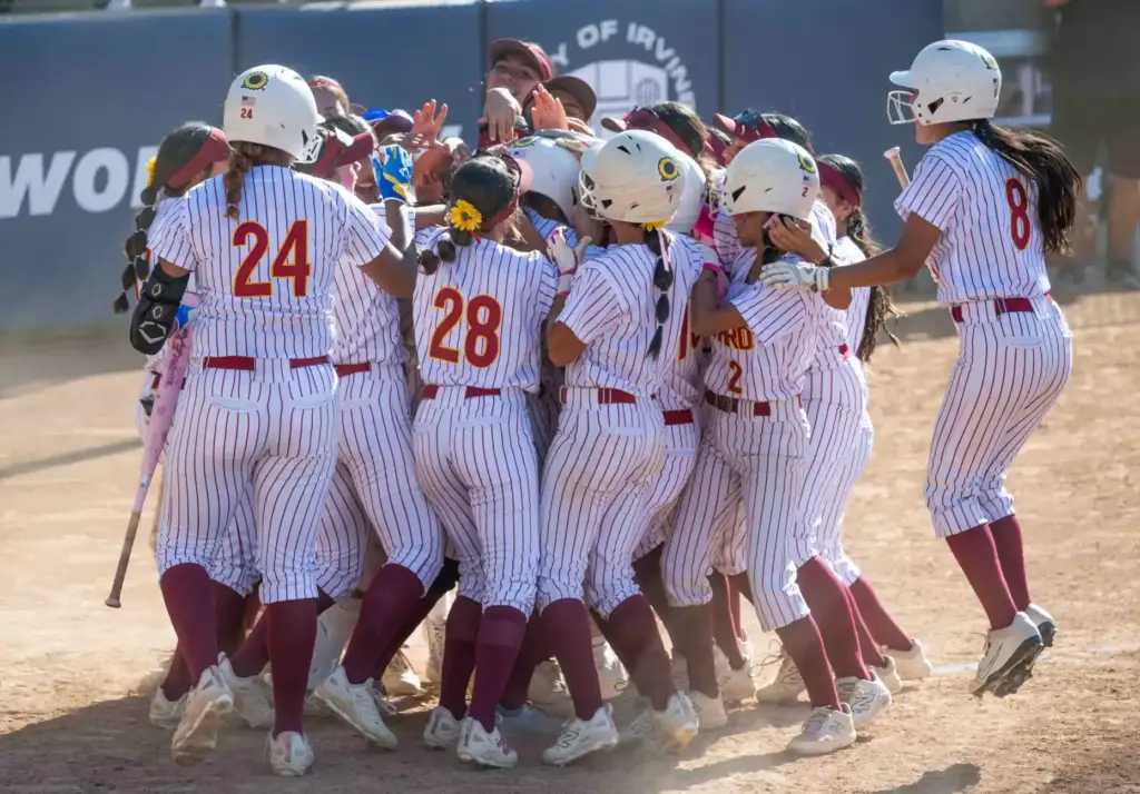 Oxnard players celebrate a 3-run home run by third baseman...