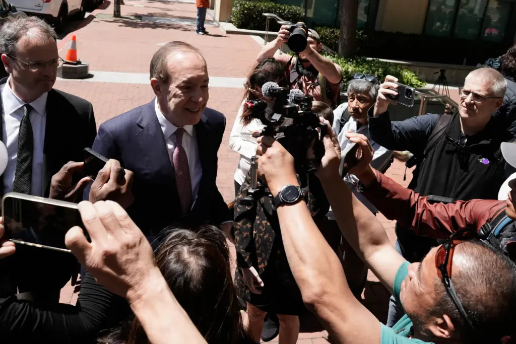 Steven F. Molo, attorney for Elon Musk, speaks to reporters.