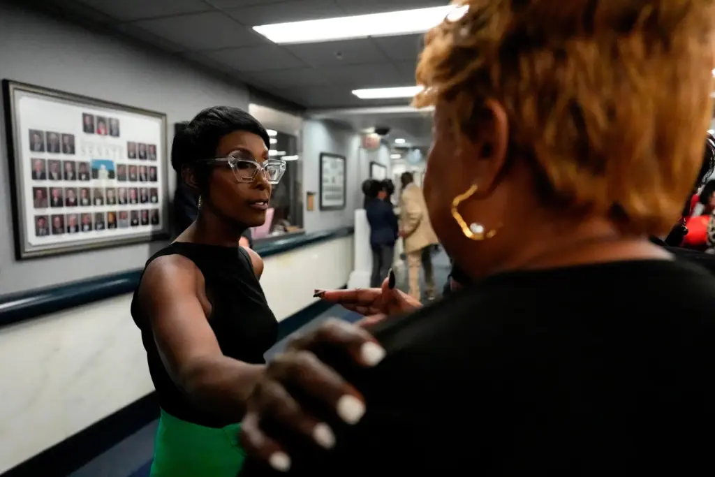Democrat Alabama State Rep. Juandalynn Givan speaks with a demonstrator.