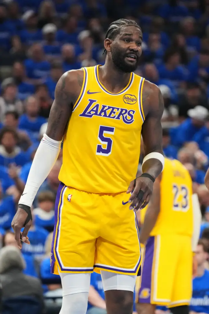 Lakers center Deandre Ayton talks to an official, not pictured,...