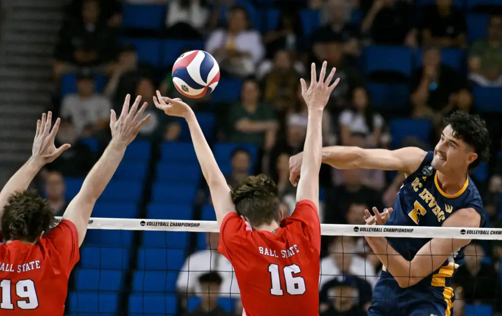 UC Irvineâs William D’Arcy, right, spikes the ball during an...