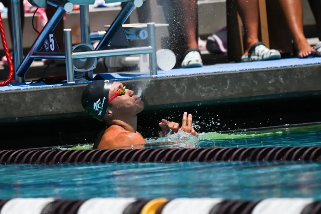 Andrew Maksymowski of Northwood High School blows water in celebration...