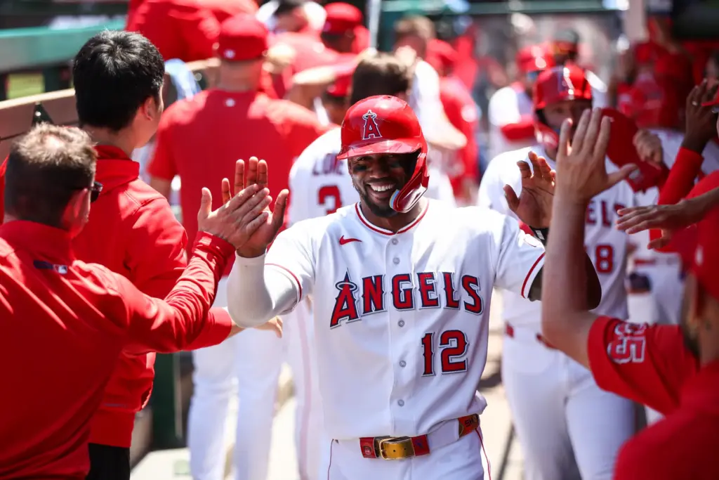 The Angels’ Jorge Soler celebrates with teammates in the dugout...