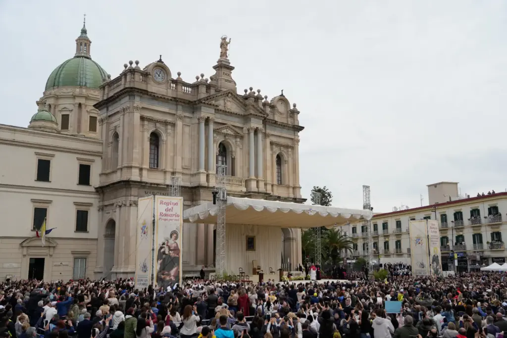 Pope Leo XIV greets the faithful in front of the Pompeii Shrine.