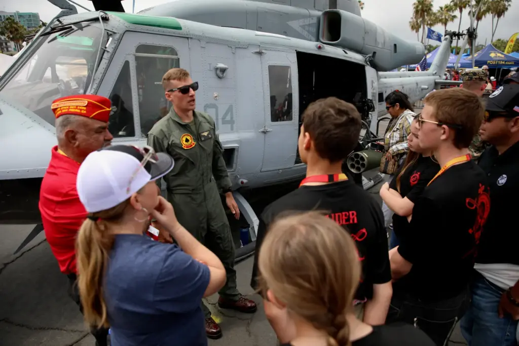 Attendees have the opportunity to chat with military personnel on...