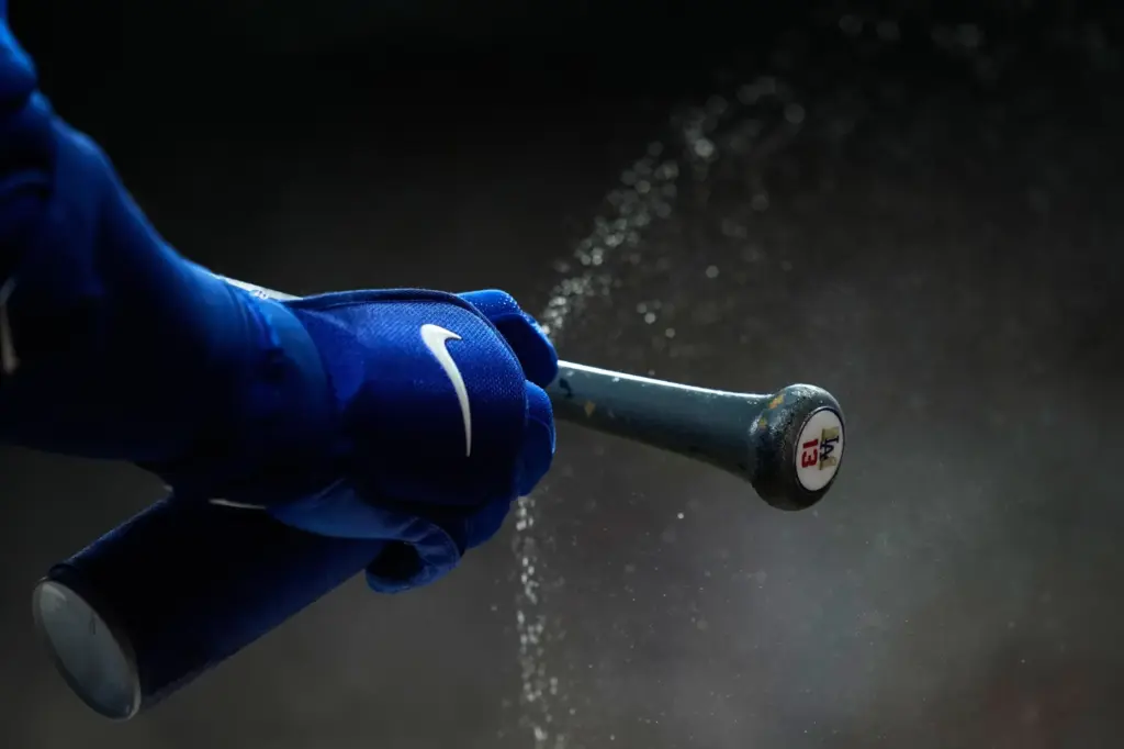 The Dodgers’ Max Muncy prepares his bat during the first...