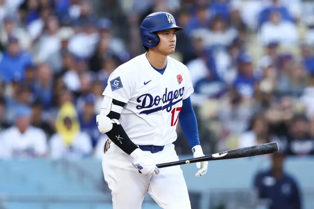 The Dodgers’ Shohei Ohtani looks on after being walked during...