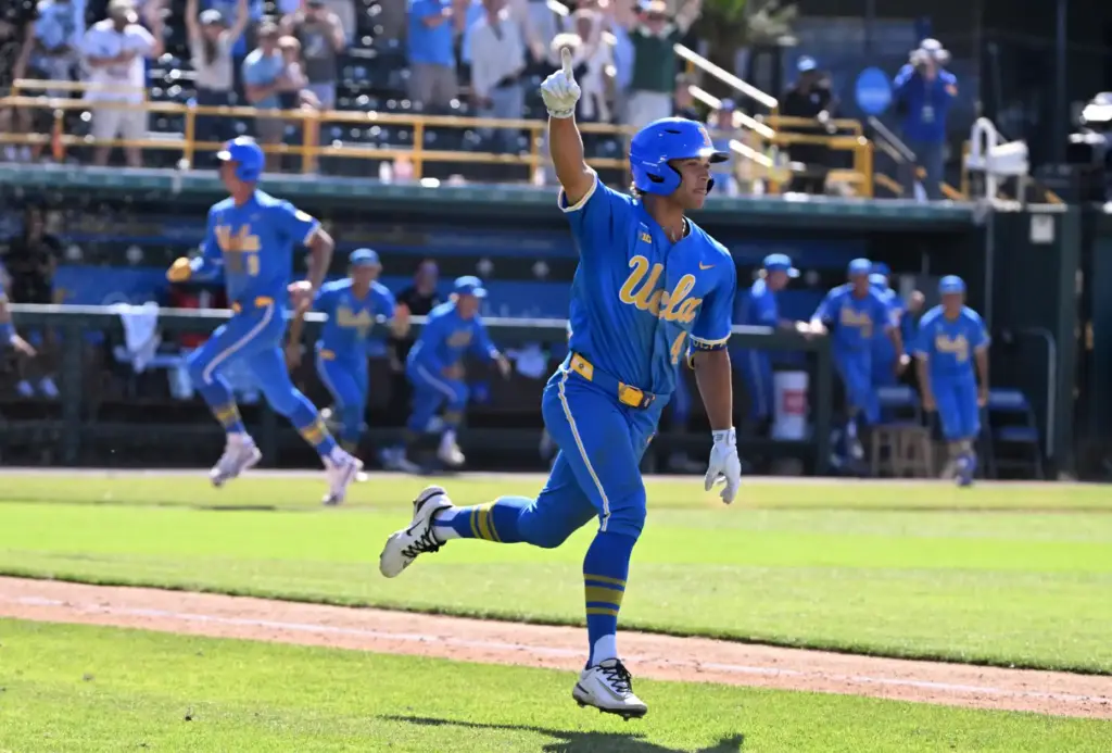 Phoenix Call #4 of the UCLA Bruins reacts after hitting...