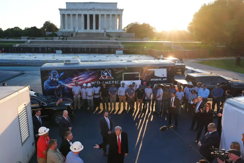 President Donald Trump talks as he visits the Lincoln Memorial Reflecting Pool.