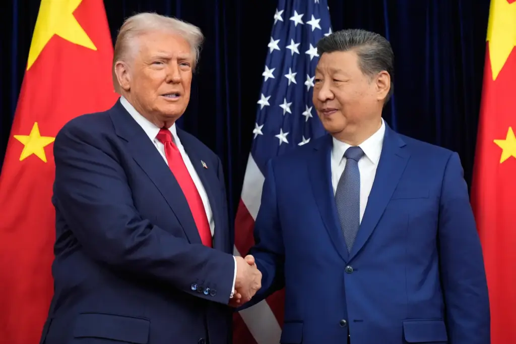 FILE – President Donald Trump, left, and Chinese President Xi...