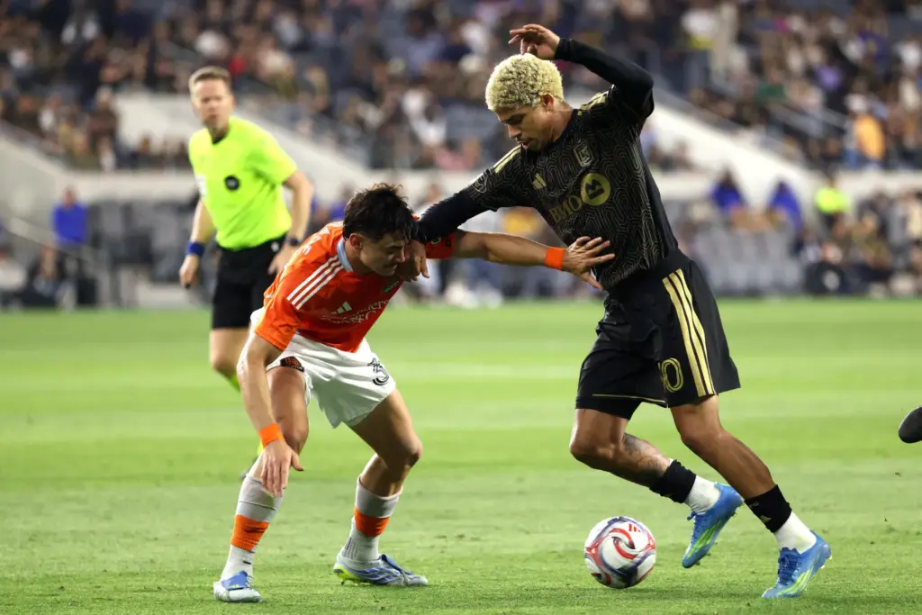 LAFC forward David MartÃ­nez, right, is stopped by Houston Dynamo...