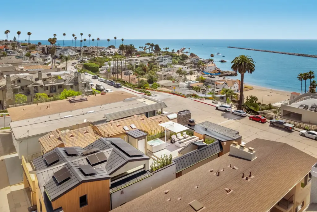An aerial view of the house shows the rooftop terrace....