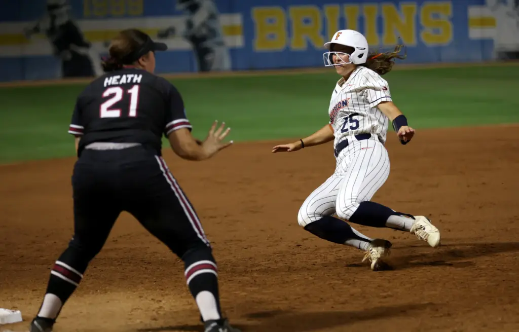 Cal State Fullertonâs Ava Arce (25) begins to slide into...