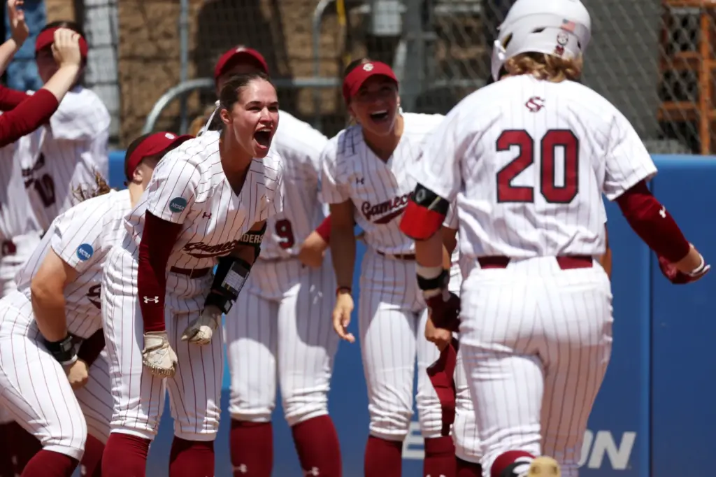 South Carolinaâs Shae Anderson, left, cheers on Jamie Mackay (20)...