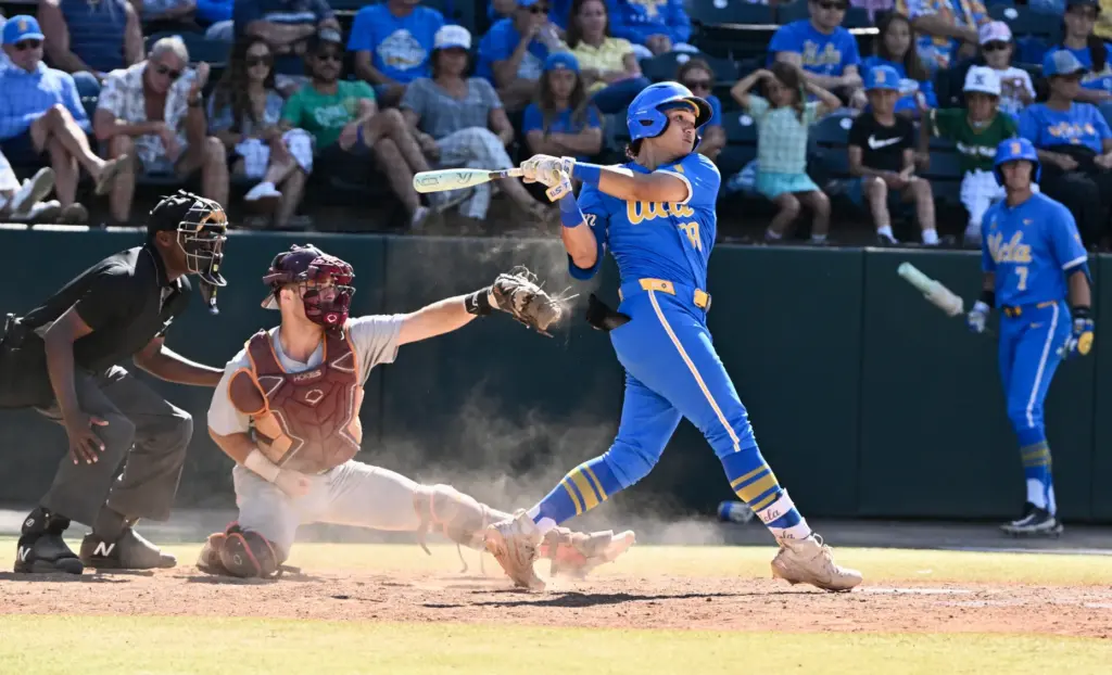 Mulivai Levu #39 of the UCLA Bruins hits a solo...