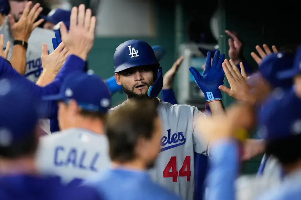 The Dodgers’ Andy Pages celebrates in the dugout after hitting...
