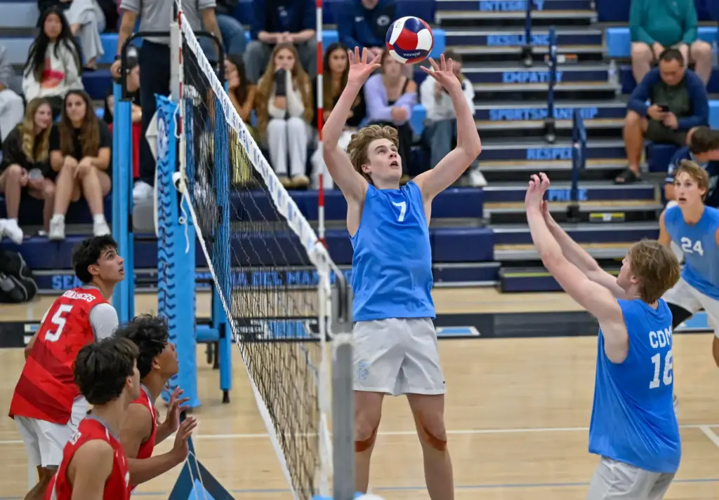 Corona del Mar setter Drake Foley sets the ball during...