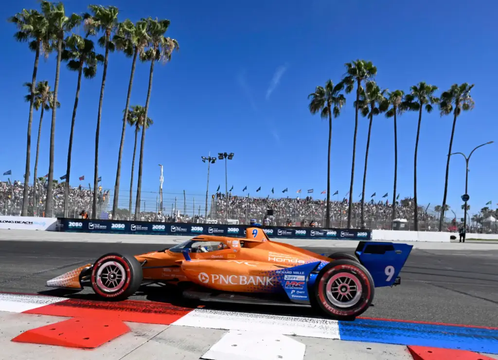 Indycar driver Scott Dixon races towards the hairpin during the...