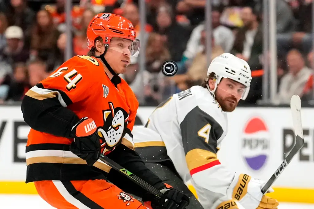 Ducks center Mikael Granlund, left, and Vegas Golden Knights defenseman...