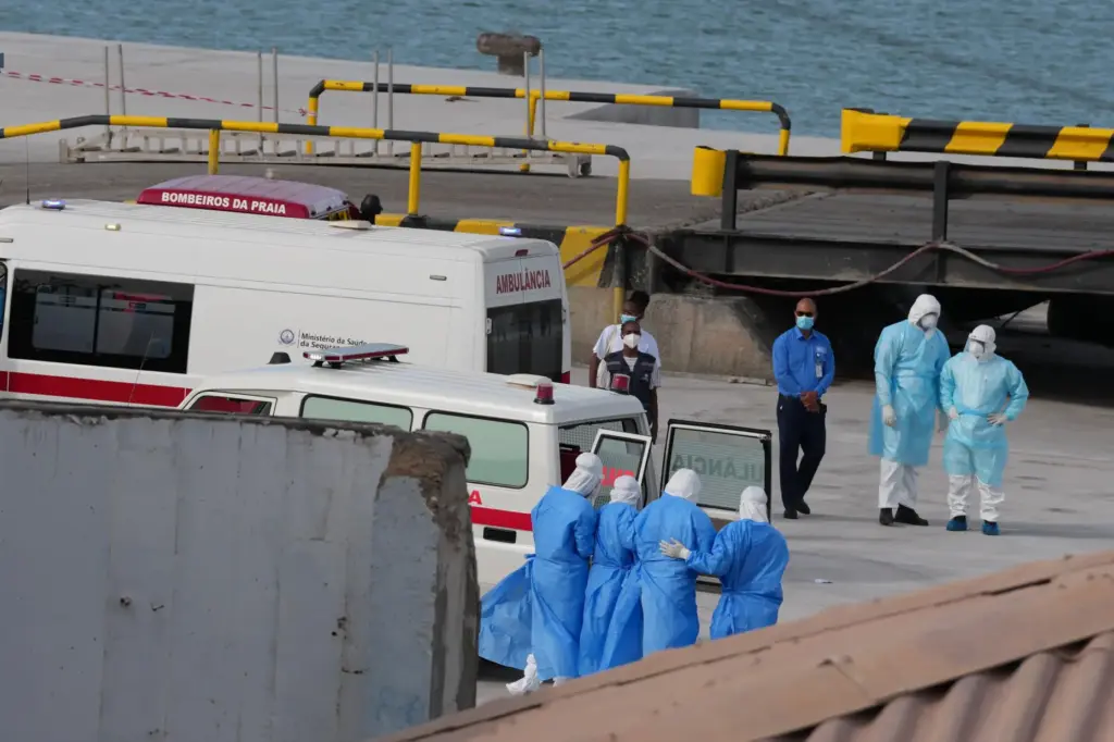 Health workers in protective gear evacuate patients from the MV Hondius cruise ship.