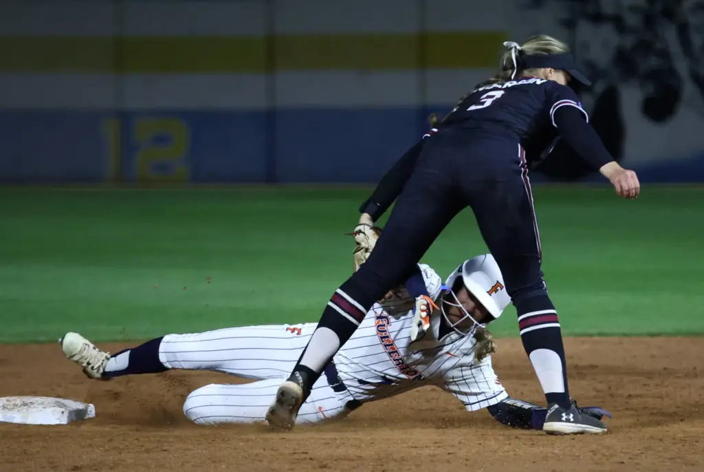 Cal State Fullertonâs Briona Ferdman (7) is tagged out by...