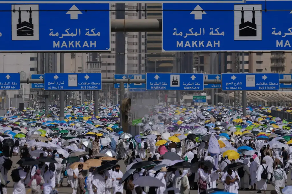 Muslim pilgrims leave after casting pebbles at pillars in the...